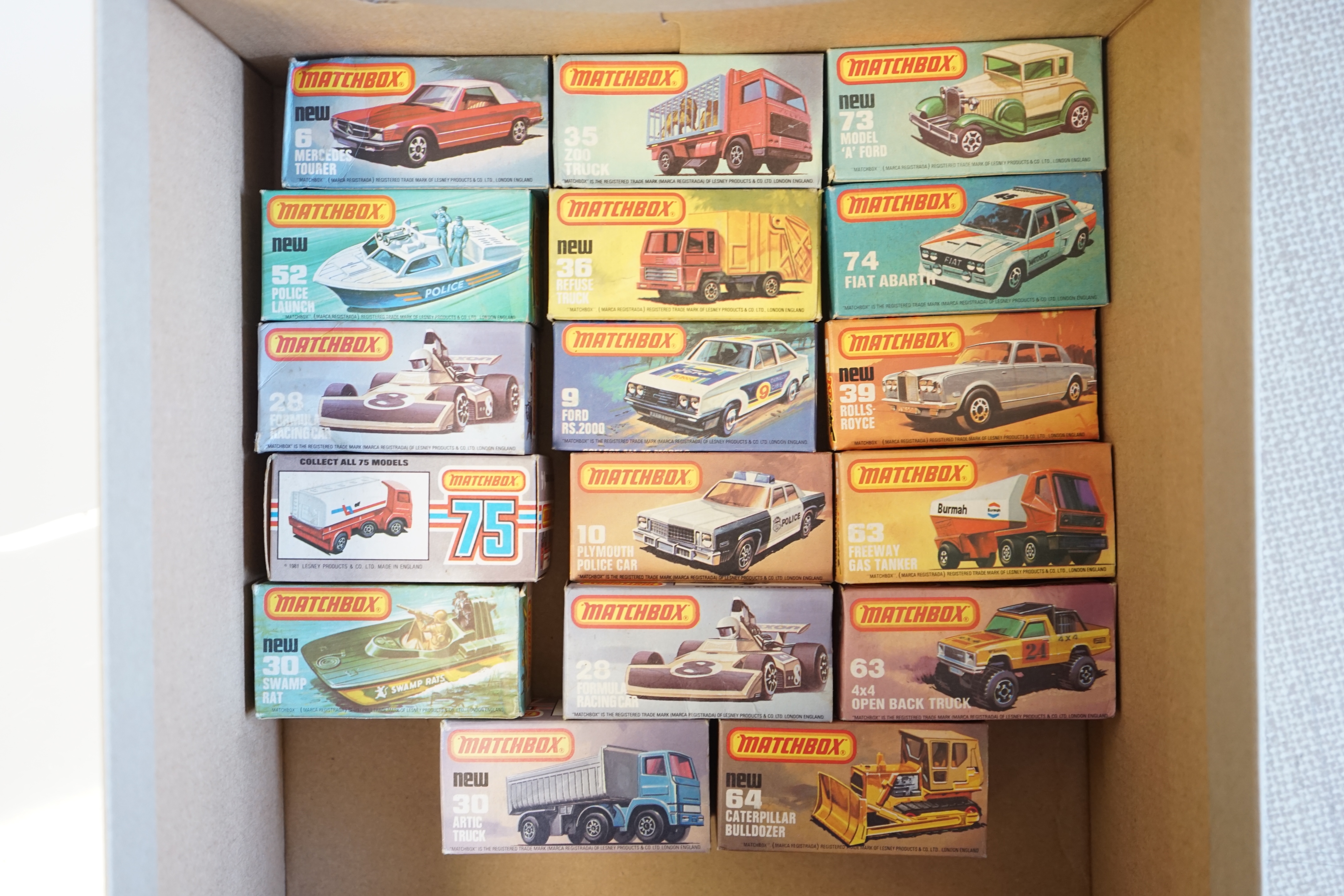 Seventeen boxed Matchbox Series 1-75 diecast vehicles including; 6; Mercedes Tourer, 9; Ford RS 2000, 10; Plymouth Police Car, 14; Petrol Tanker, 28; Formula One Racing Car and another, 30; Artic Truck, 30; Swamp Rat, 35